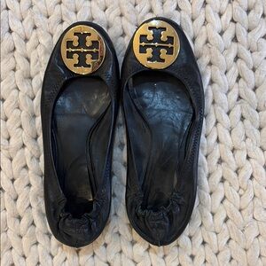 Tory Burch Black and Gold Leather Loafers with Signature Emblem